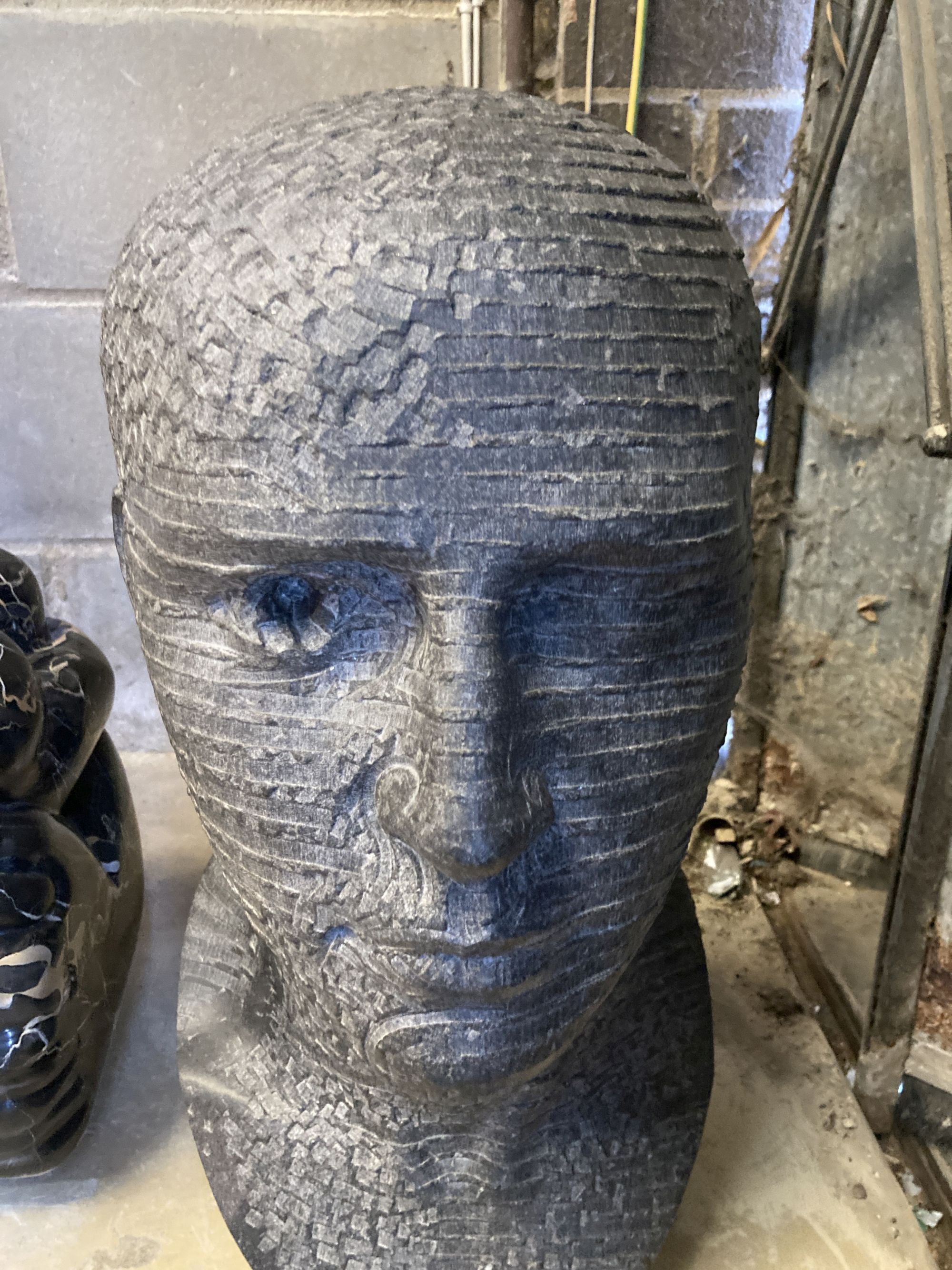 § Andrew Tanser, Communicate, a carved Kilkenny limestone head, width 24cm, depth 30cm, height 56cm